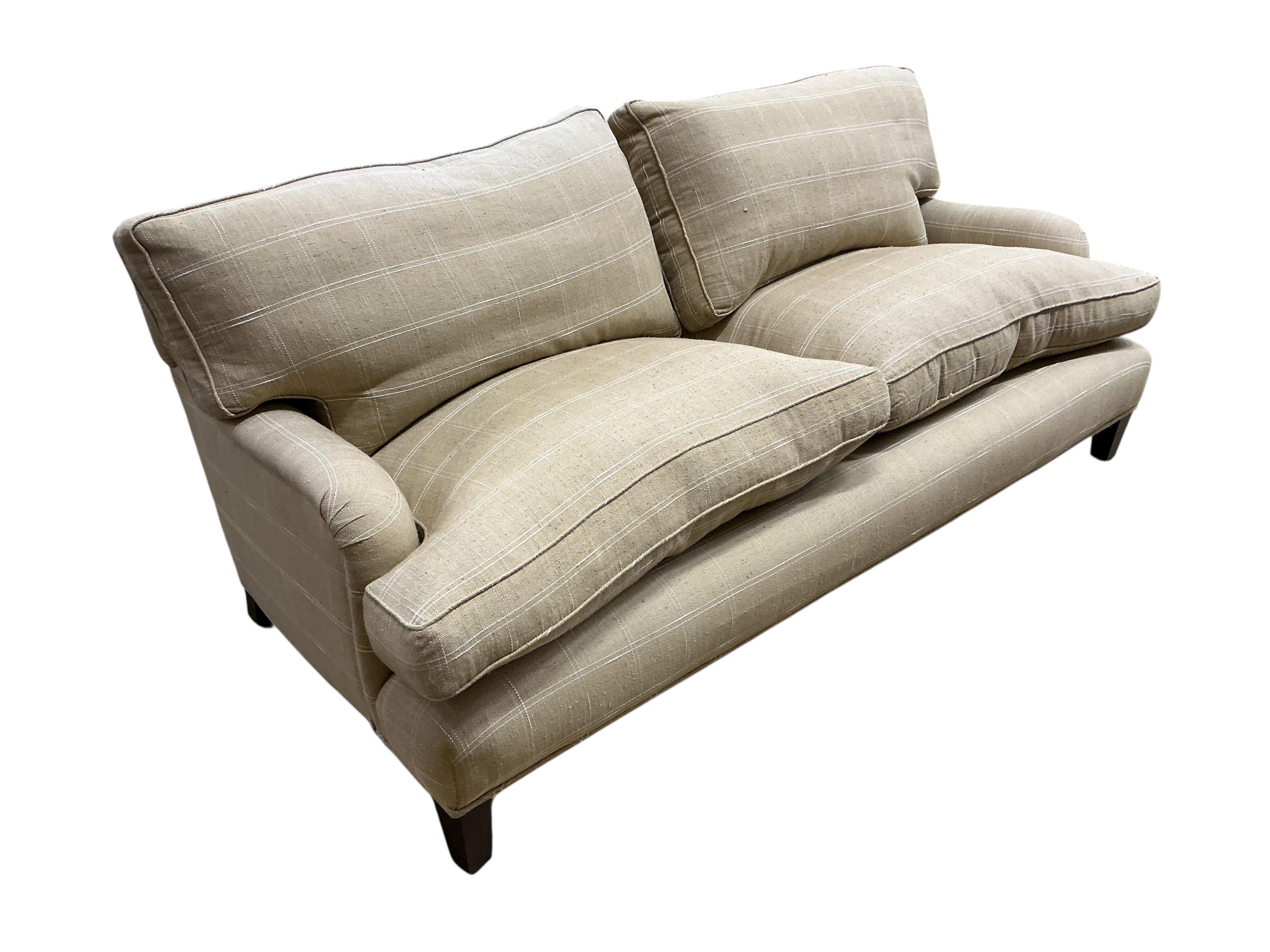 A pair of large grey and white squared upholstered settees, width 200cm, depth 90cm, height 84cm and a pair of matching armchairs